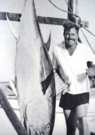 Ernest Hemingway with a prized Tuna caught off of Bimin